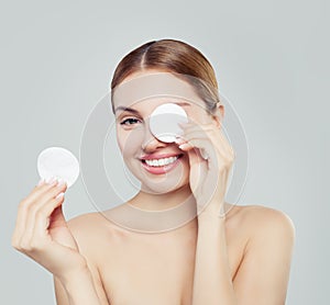 Cotton pad woman face, cosmetology and remover makeup. photo