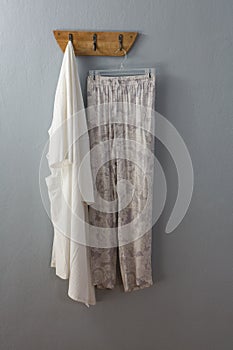 Cotton pant and top hanging on hook