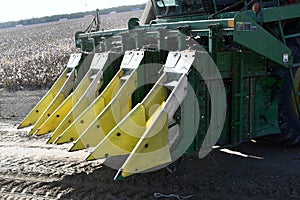 A cotton picker harvests cotton with a cotton gin