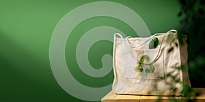 Cotton Recycling Bag on Wooden Table by Green Wall. Zero Waste Products. Environment, Ecology Care, Renewable