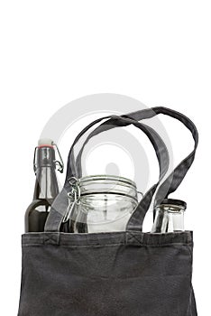 Cotton shopping bag, jar and bottle on a white background