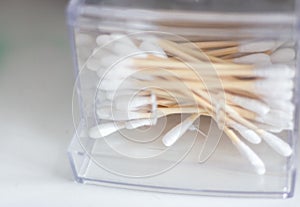 Cotton swabs in box. Healthcare accessory. Ear sticks in bathroom. Soft swabs close up. Hygeine tools. Personal sanitary concept.