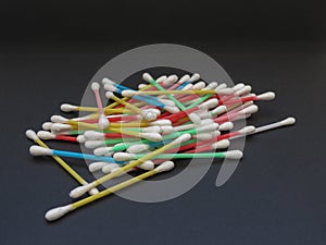 Cotton swabs over black background