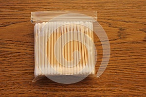 Cotton swabs on wooden shafts in packet photo
