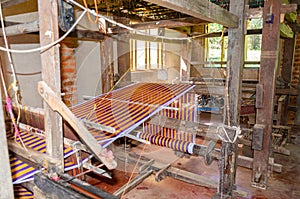 Cotton weaving on a traditional wooden handloom