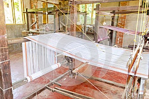 Cotton weaving on a traditional wooden handloom