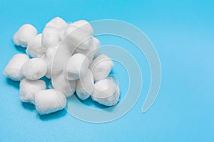 Cotton wool on blue background, Delicate soft cotton wool background, with copy space.