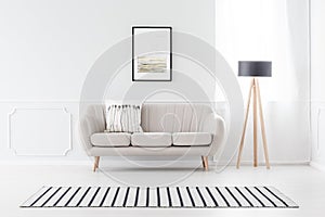 Couch against wall with molding photo