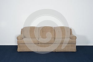 Couch or Davenport, Blue Carpet, Blank White Wall photo