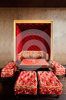 Couch in niche, table and stools in restaurant photo