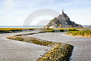 The Couesnon river flowing to the Mont Saint-Michel tidal island in Normandy, France