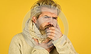 cough and runny nose first symptoms. brutal male get flu in winter. warm up with knitwear. bearded hipster sick