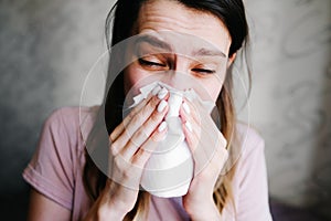 Cough in tissue covering nose and mouth when coughing as COVID-19