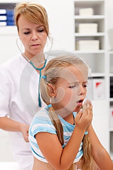 Coughing little girl on health checkup