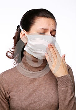 Coughing woman in a medical mask