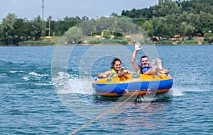 Couiple on water attractions during summer vacations