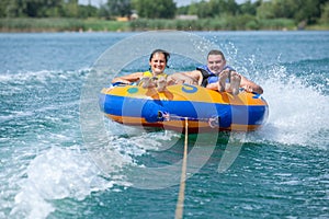 Couiple on water attractions during summer vacations