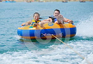 Couiple on water attractions during summer vacations