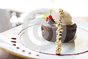 Coulant. Molten chocolate cake is a popular dessert that combines the elements of a flourless chocolate cake and a soufflé.