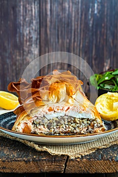 Coulibiac - salmon stuffed with rice, mushrooms,onion,dill and hard-boiled egg photo