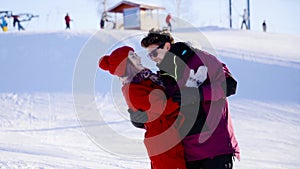 Coulple in love in mountain ski resort at sunny day. Winter, sport, holidays, relationship, love, xmas, lifestyle