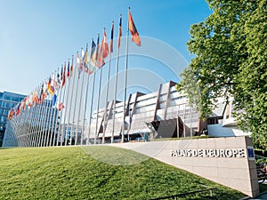 Council of Europe with UK and France flag half-mast