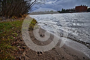 Council Grounds State Park in WPS Hydrolectric Dam beyond deer prints in the sandy shore photo