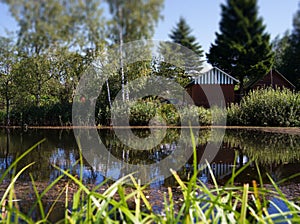 Counrtyside pond with dramatic reflections background