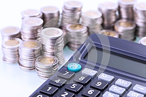 Couns and calculator on white background