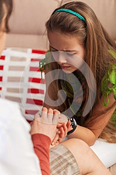 Counseling professional woman trying to provide comfort to sad teenager girl - close up