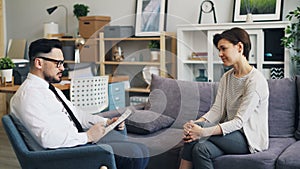 Counsellor speaking with patient in office giving advice during appointment