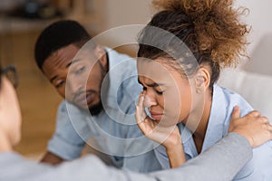 Counselor Comforting Desperate Afro Woman Crying At Couples Therapy