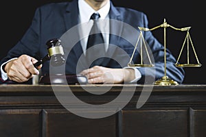 Counselor or Male lawyer working on courtroom sitting at the table. Legal law, Judge gavel with Justice lawyers advice with gavel