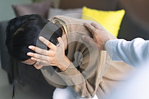 Counselor touching friend shoulder and encouraging to help relieve her sad