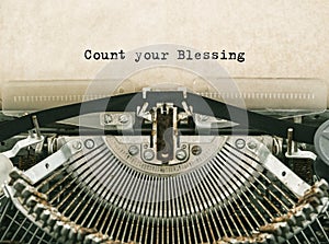 Count your Blessing typed words on a vintage typewriter.