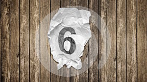 Countdown numbers on wrinkled paper texture