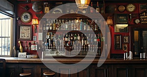 the counter bar in a cosy old english or irish pub with lots of whisky bottles in the background.