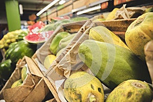 The counter with fresh fruit and vegetables in the supermarket.