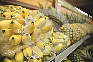 The counter with fresh fruit and vegetables in the supermarket.