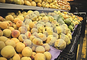 The counter with fresh fruit and vegetables in the supermarket.