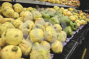 The counter with fresh fruit and vegetables in the supermarket.