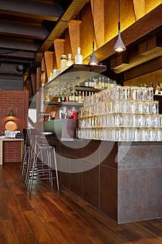 Counter with many empty beer mugs, beverages in