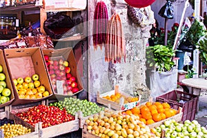 Counter with vegetables and fruits in the market