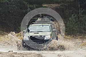 Countering challenging terrain obstacles on a armed patrol army truck