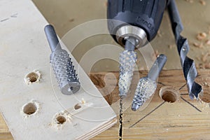 Countersink used in joinery for reaming holes. Joinery accessories on a workshop table