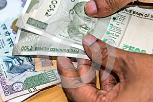 Counting Indian rupee currency,money