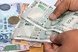 Counting Indian rupee currency,money