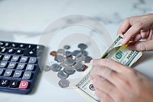 Counting money American dollars with hand , Income and Saving money concept for saving money wealth and financial concept.