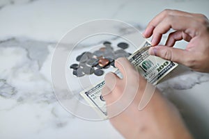 Counting money American dollars with hand , Income and Saving money concept.