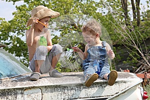 Country boys laughing and playing in the summer